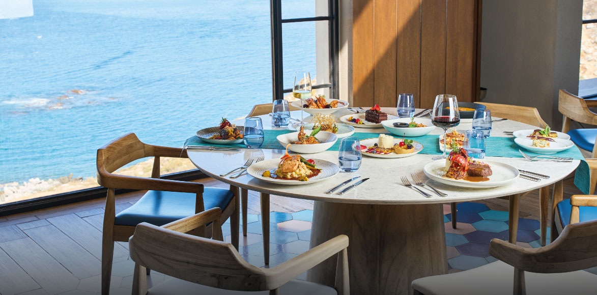 Dining at an ocean view restaurant at Mexico Grand Hotels.